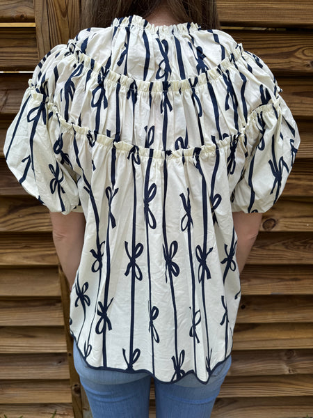 The White & Navy Ribbon Ruffle Blouse